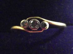 18 ct gold three stone diamond ring, size N1/2