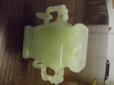 Small carved jade lidded vase with ringlets, resto