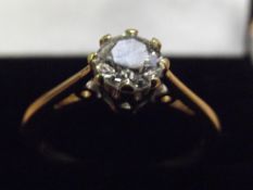 18ct gold and diamond ring. Solitaire central half