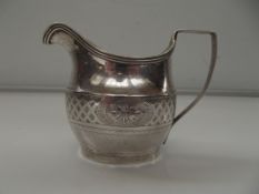 George III silver cream jug, helmet form, reeded e