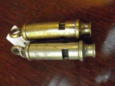 One military and one police whistle