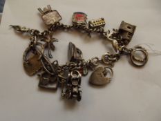 Silver charm bracelet with charms