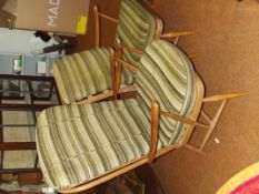 Two blonde Ercol armchairs