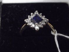 18ct gold diamond and blue stone ring