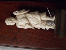 Figure of an Oriental man on a plinth, possible iv