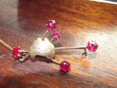 9ct gold brooch with 4 red stones, possibly ruby