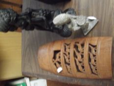 Two carved wood figures and one other