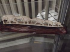 Graduating elephants on a plinth, possible ivory