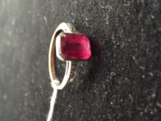 9 ct gold ring with large red stone