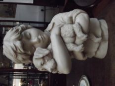 Resin figure of a boy and a dog