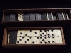 Two boxes of dominoes