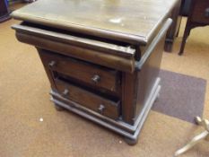 Four drawer chest of drawers on bun feet