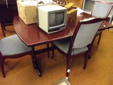 Mahogany extending dining table and four chairs
