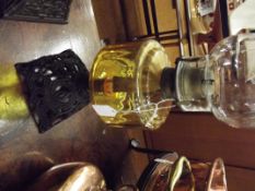 Oil lamp with amber glass reservoir and cast iron