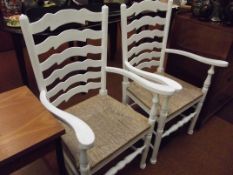 Pair of rush seated ladder back carver chairs, pai