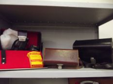 Shelf of vintage camera equipment