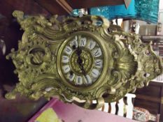 Rococo style brass mantel clock, striking on a bel