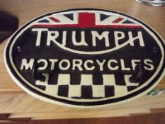 Cast iron Triumph sign with hooks