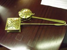 Two brass chestnut roasters