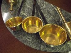 Set of three graduating brass pans
