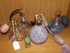 4 glass atomisers together with a scent bottle
