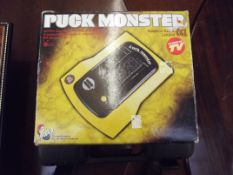 Puck monster handheld game together with a drill (