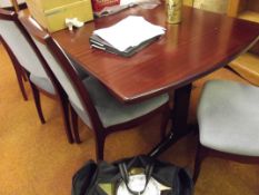 Extending dining table and four chairs