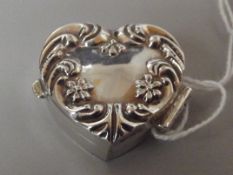 Silver pill box in the form of a heart