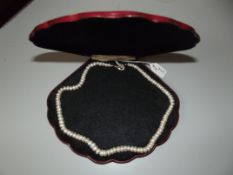 Good quality cased pearl necklace