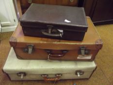 Three vintage suit cases