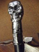 Walking stick with stylised skull finial