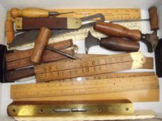 Collection of vintage tools and boxwood rulers