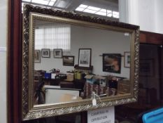 Framed bevelled edge wall mirror