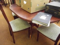 Extending dining table and four chairs