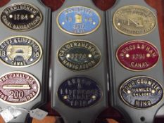 3 mounted plaques with various canal signs