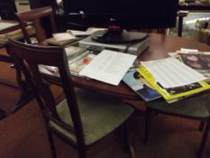 Extending dining table and four chairs