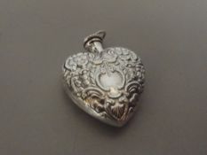 Silver stamped perfume bottle, heart