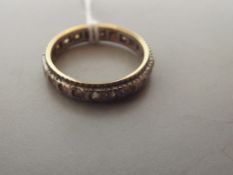 Yellow and white metal eternity ring