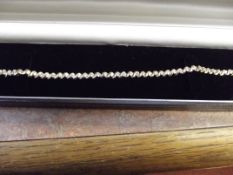 9 carat gold bracelet set with white stones