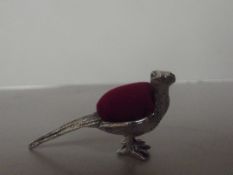 Silver stamped pin cushion, peacock