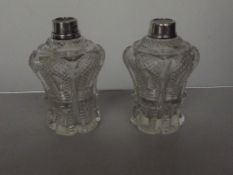 Two silver rimmed scent bottles