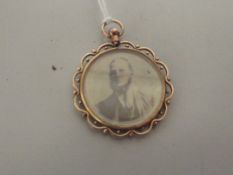 Yellow metal double faced pendant
