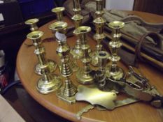 Collection of brass candlesticks, some Victorian e