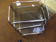 Nest of three chrome framed tables