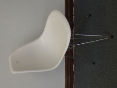 Eames inspired chair in white fibre glass seat wit
