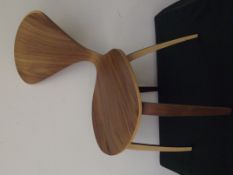 Brown wood chair with heart back