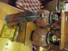 Three lanterns together with a money box in the fo