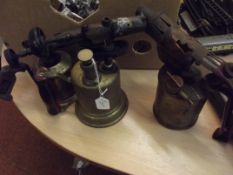 Three vintage brass blow lamps