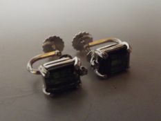 18 ct white gold earrings with green stone and dia