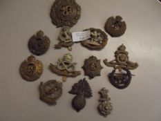 Collection of early military cap badges